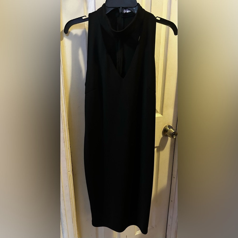 Glamours Brand black dress with cutout.